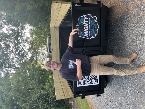 Tallas, coβowner of Mighty Dump and Demolition